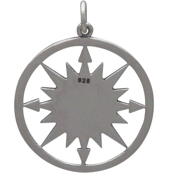 Sterling silver compass charm with mountain top design in the center Back View